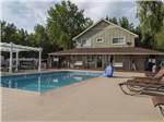The swimming pool with lounge chairs at LAKESIDE RV CAMPGROUND - thumbnail
