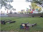 The horseshoe pits with colorful horseshoes at LAKESIDE RV CAMPGROUND - thumbnail