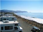 RVs parked along ocean with pier in background at SAN FRANCISCO RV RESORT - thumbnail