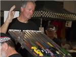 Man watching slot car race at VALLE DEL ORO RV RESORT - thumbnail