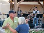 A couple dancing to a live band at SUNFLOWER RV RESORT - thumbnail