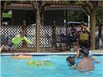 Kids playing in the pool at CAJUN RV PARK - thumbnail