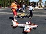 Man getting ready to fly remote controlled airplane at RINCON COUNTRY WEST RV RESORT - thumbnail
