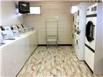 Laundry room with washers and dryers at OASIS CAMPGROUND - thumbnail