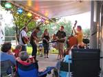 Campers being entertained by a band at ASHEVILLE BEAR CREEK RV PARK - thumbnail