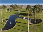 Aerial view of the pond and fountain on the golf course at WESTWIND RV & GOLF RESORT - thumbnail
