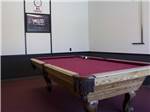 The red billiard pool table at DESERT WILLOW RV RESORT - thumbnail