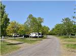 Trailers parked in gravel sites at CAMPARK RESORTS FAMILY CAMPING & RV RESORT - thumbnail