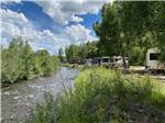 RVs parked by the water at RIO CHAMA RV PARK - thumbnail