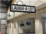 The hanging Laugh-A-Lot sign at RIO CHAMA RV PARK - thumbnail