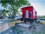 The back end of the red caboose at BANDERA PIONEER RV RIVER RESORT - thumbnail