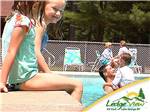 Kids swimming in the pool at LEDGEVIEW RV PARK - thumbnail