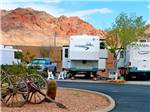 A view of RV sites with mountains in the background at CANYON TRAIL RV PARK - thumbnail