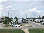 Looking down the row of RV sites at ROADRUNNER RV PARK - thumbnail