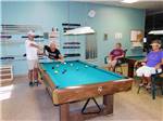 A group of people playing pool at FIG TREE RV RESORT - thumbnail