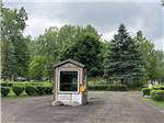 The entrance kiosk in the middle of the road at CAMP LORD WILLING RV PARK & CAMPGROUND - thumbnail