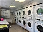 The row of dryers in the laundry room at CAMP LORD WILLING RV PARK & CAMPGROUND - thumbnail