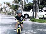 A child riding a bike at VENTURA BEACH RV RESORT - thumbnail