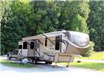 A fifth wheel trailer in a gravel RV site at LEISURE ACRES CAMPGROUND - thumbnail