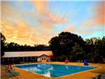 The swimming pool at sunset at INDIAN ROCK RV PARK - thumbnail