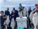A group of anglers with their latest catches at ALASKAN ANGLER RV RESORT & CABINS - thumbnail