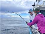 A couple fishing on the water at ALASKAN ANGLER RV RESORT & CABINS - thumbnail
