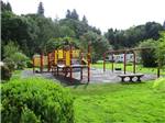 Playground with swing set at LAKE PLEASANT RV PARK - thumbnail