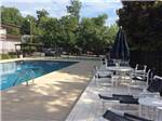 Swimming pool with outdoor seating at LAKEWOOD RV RESORT - thumbnail