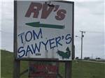 The front entrance sign at TOM SAWYER'S RV PARK - thumbnail