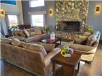Three couches in front of the fireplace at SILVER CITY RV RESORT - thumbnail