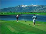 Two people playing golf at SILVER CITY RV RESORT - thumbnail