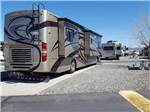 A motorhome in a paved RV site at SILVER CITY RV RESORT - thumbnail