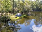 A tent site by the lake at LAKE AIRE RV PARK & CAMPGROUND - thumbnail