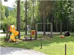 A playground with slide and swing set at DORSET RV PARK - thumbnail
