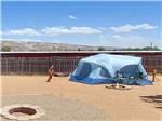 A tent pitched at a campsite at CANYONS OF ESCALANTE RV PARK - thumbnail