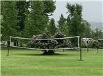 A volleyball net in a grassy area at RIVERFRONT RV PARK - thumbnail