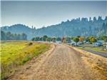 A dirt road leading to the RV sites at BROOKHOLLOW RV PARK - thumbnail