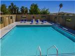 Large pool onsite for guests at TWENTYNINE PALMS RESORT RV PARK AND COTTAGES - thumbnail
