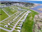 Aerial shot of paved sites surrounded by grass at OCEAN SURF RV PARK - thumbnail