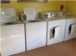 The washer and dryers in the laundry room at GRAPE CREEK RV PARK CAMPGROUND & CABINS - thumbnail