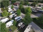 Aerial view of multiple RVs and red barn at CAHOKIA RV PARQUE - thumbnail
