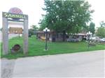 Barbeque restaurant alongside large advertising sign at CAHOKIA RV PARQUE - thumbnail