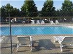 Swimming pool with outdoor seating at FORT CHISWELL RV PARK - thumbnail