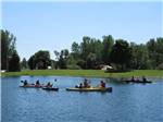 A group of people in canoes on the lake at NIAGARA COUNTY CAMPING RESORT - thumbnail