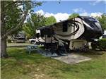 A fifth wheel trailer in a RV site at SUNSET KING LAKE RV RESORT - thumbnail