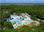 Aerial shot of buildings, pool and lazy river at THE CAMPGROUND AT JAMES ISLAND COUNTY PARK - thumbnail