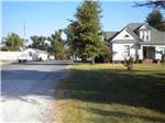 A gravel road next to a house at FERN LAKE CAMPGROUND & RV PARK - thumbnail
