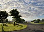 A gravel road leading to the water at CAMPING COLIBRI BY THE SEA - thumbnail