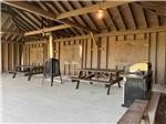 Picnic tables under a pavilion at CAMPING COLIBRI BY THE SEA - thumbnail
