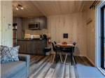 The kitchen and dining area of the cabin at CAMPING COLIBRI - thumbnail